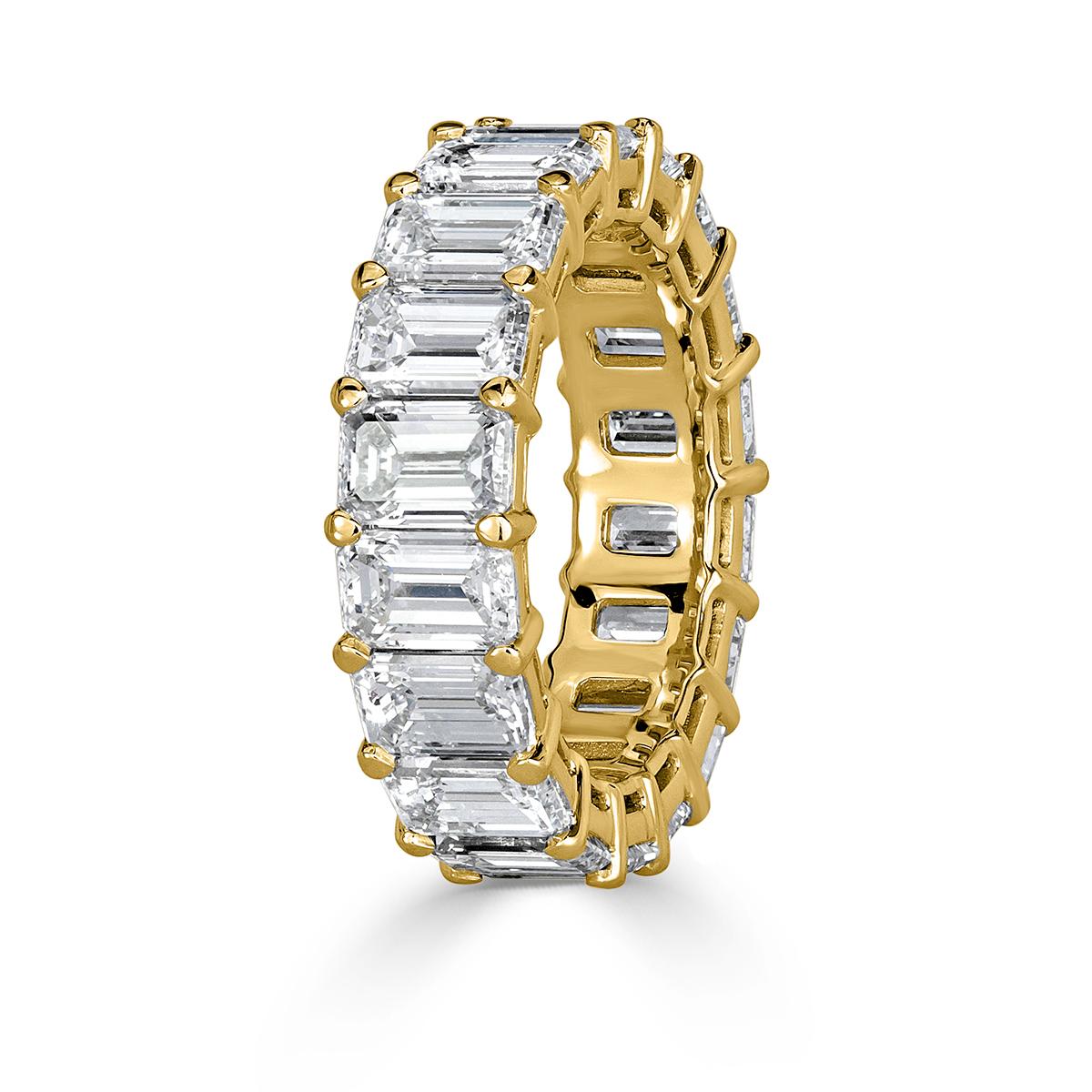 Handcrafted in 18k yellow gold, this stunning diamond eternity band showcases 9.09ct of impeccably matched emerald cut diamonds graded at E-F in color, VVS1-VVS2 in clarity. They are absolutely white and clear with each of the diamonds hand selected