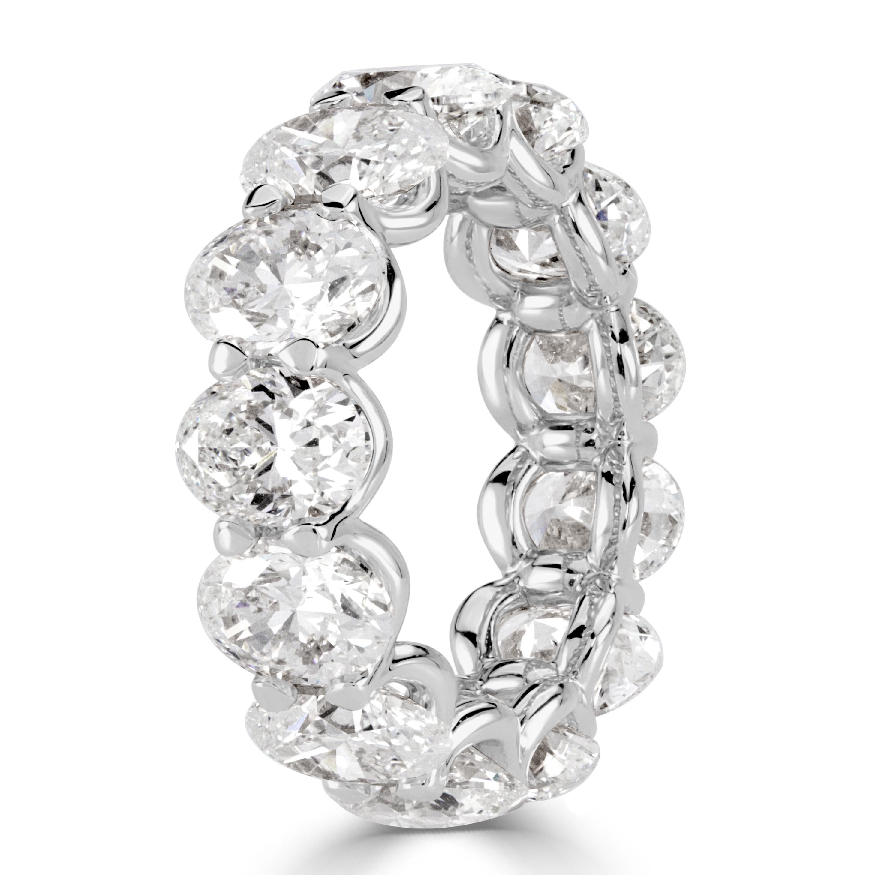 Custom created in high polish platinum, this stunning diamond eternity band showcases 9.10ct of perfectly matched oval cut diamonds GIA certified at G-H in color, VVS1-VS2 in clarity. They are set in a 