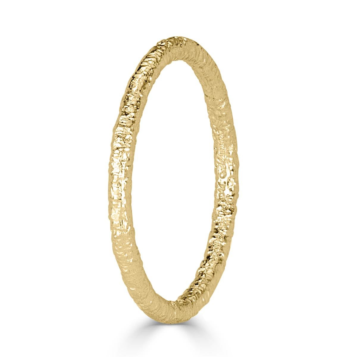 Custom created in 18k yellow gold, this lovely band features a ravishing textured design which looks stunning in a stack or as a stand alone piece.
