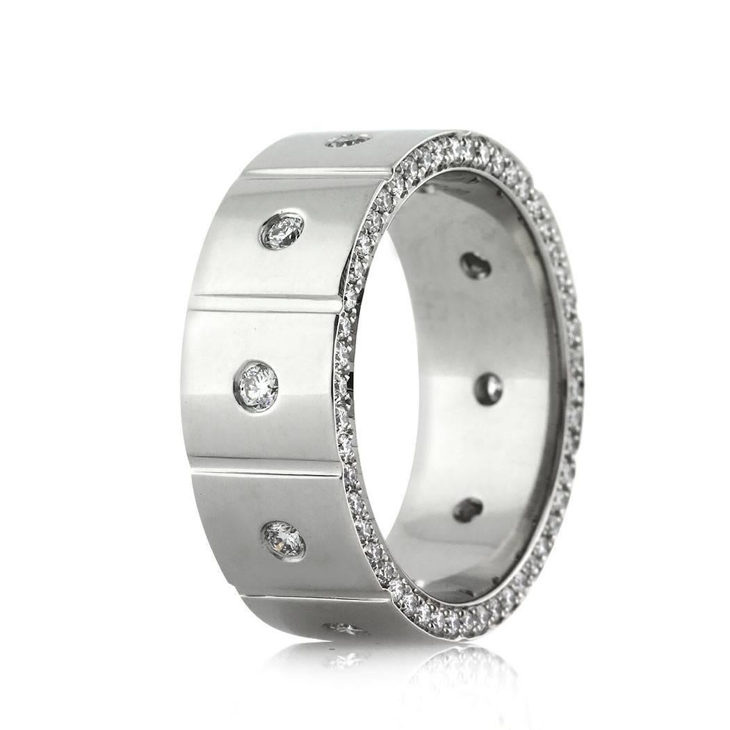 Handcrafted in platinum, this men's wedding band features an 8mm width and showcases round brilliant cut diamonds set in a flush setting on top as well as one row of sparkling diamonds pavé set on the front and the back of the ring. The diamonds