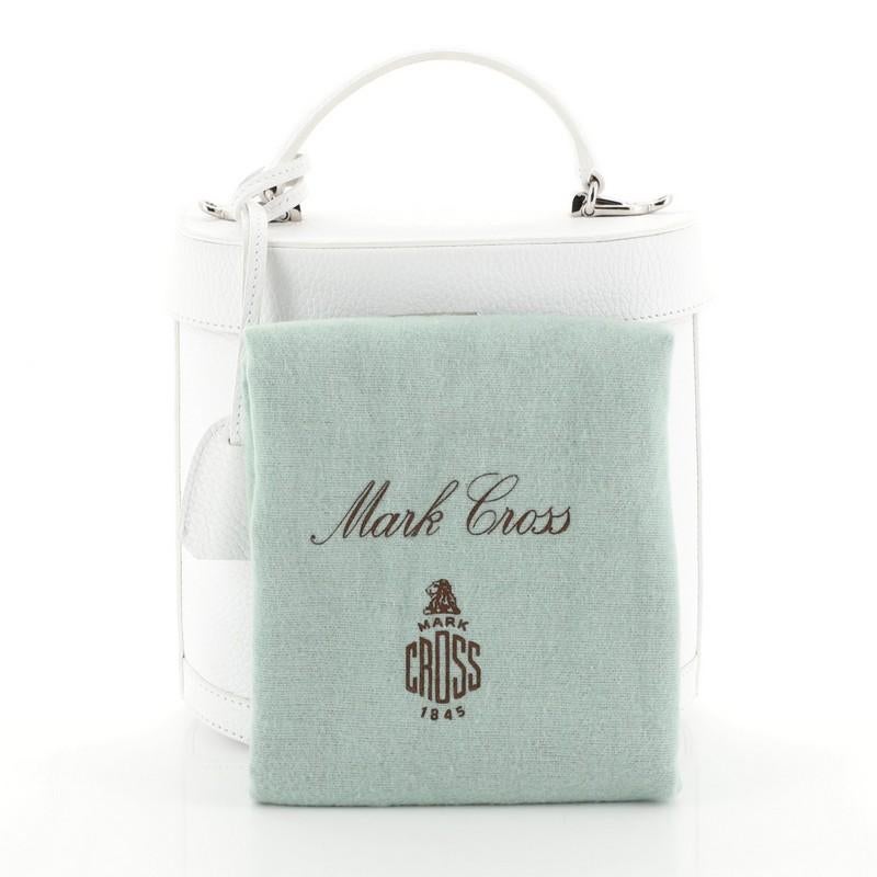 This Mark Cross Benchley Bag Leather, crafted in white leather, features leather top handle, protective base studs and silver-tone hardware. Its lock closure opens to a red leather interior with zip pocket. 

Estimated Retail Price: