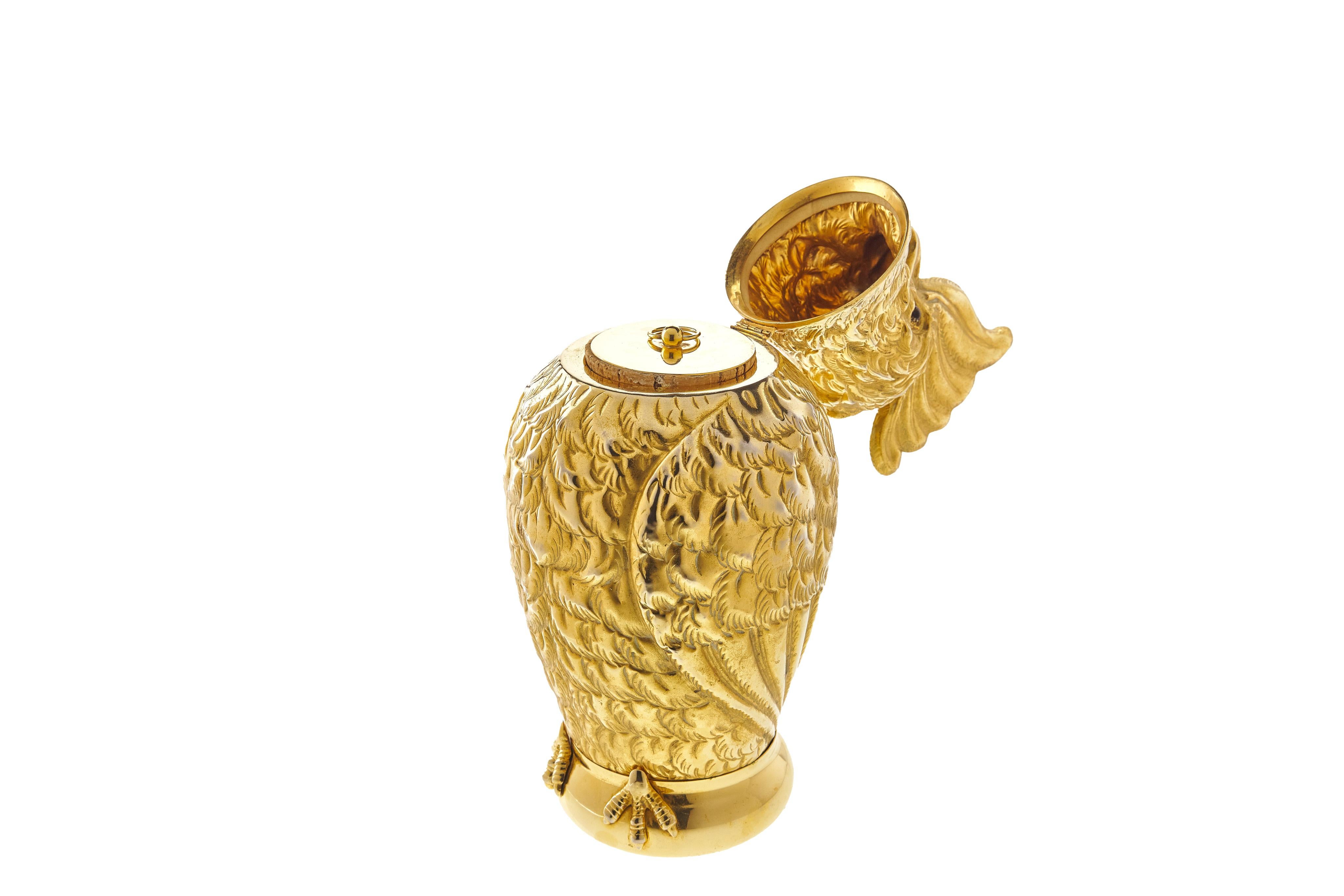 A rare figural cockatoo humidor by Mark Cross, in a gilt-metal. Featuring glass eyes and cork seal