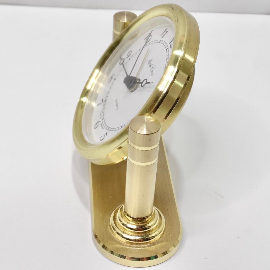 Elevate your desk set up with this stunning 1980s Mark Cross desk clock! Beautiful 18K yellow gold plating comes together with a white dial to create this classic and timeless quartz clock. Look closely at how the gold glistens in the light, this is