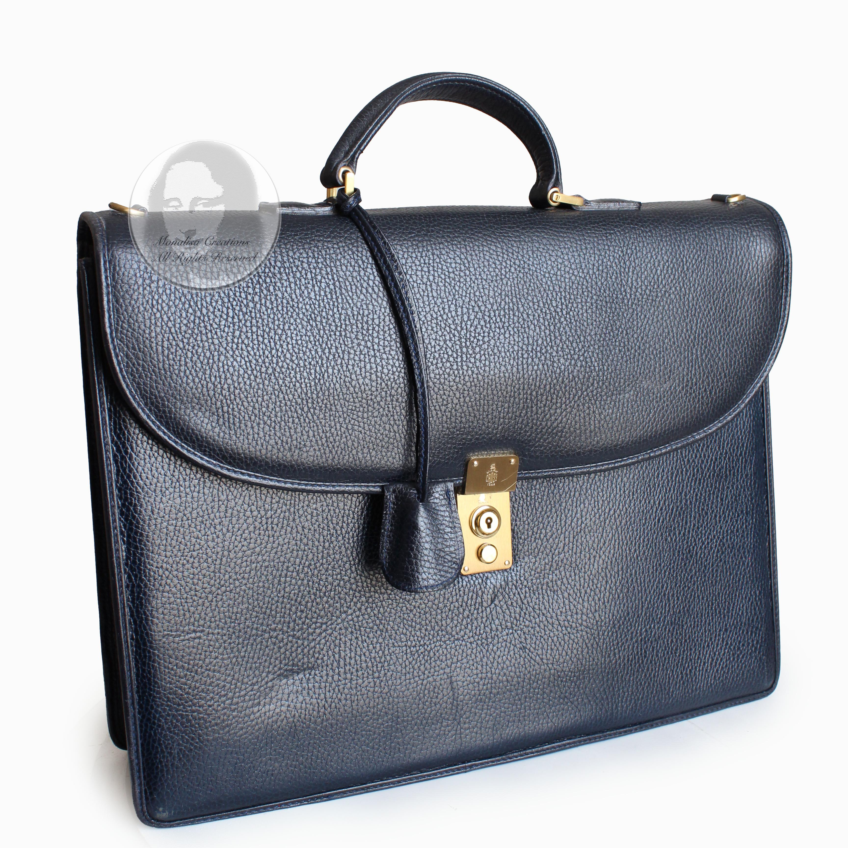 Authentic, preowned, vintage Mark Cross portfolio briefcase bag, likely made in the early 1990s. Made from a blue textured leather, it features a large flat pocket in back, a locking front latch and comes with its matching key case and two gold