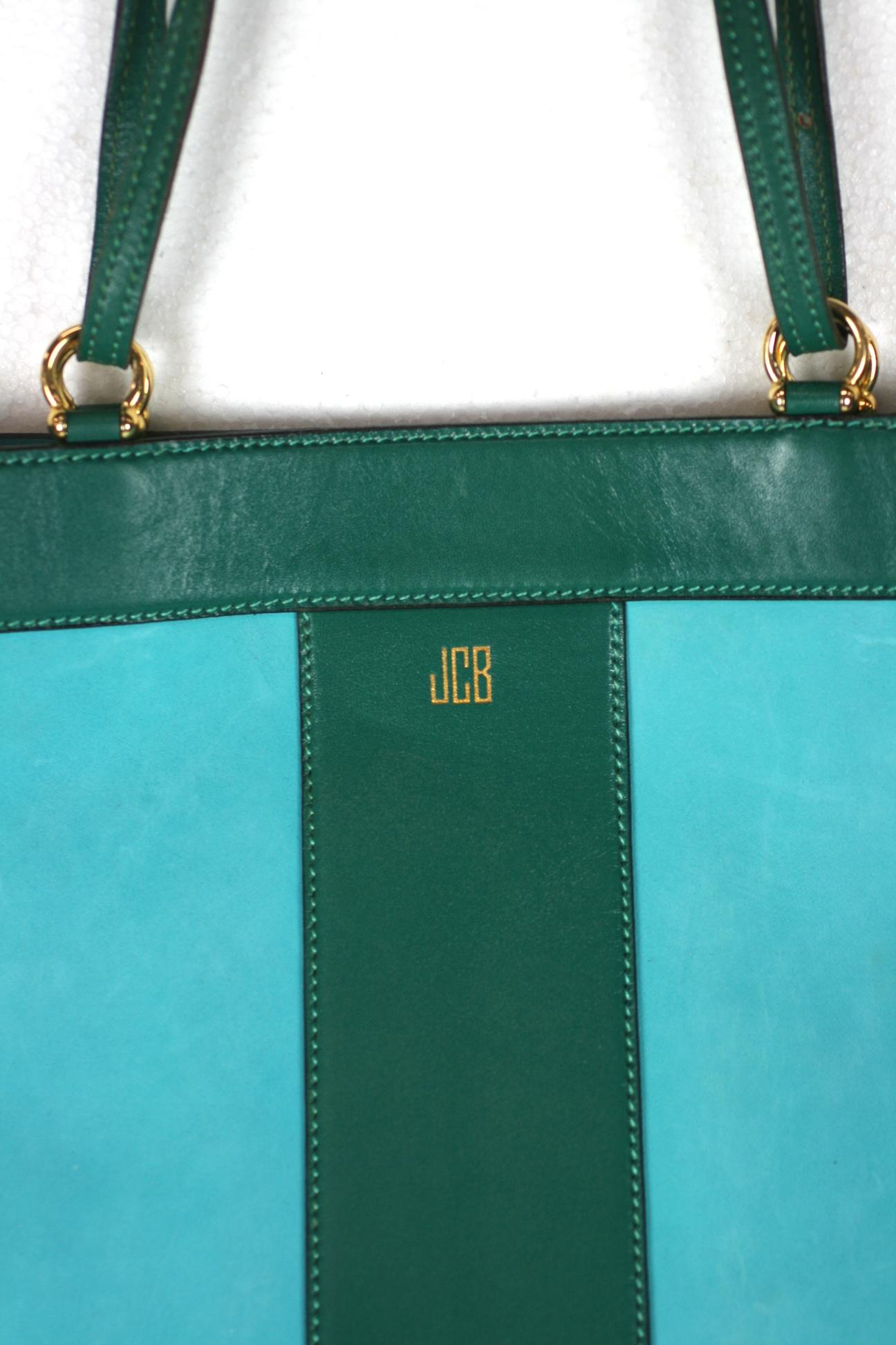 Mark Cross Turquoise and Evergreen Calf Tote with original gold monogram.  Bag expands at top of open wide but narrows at base. Unusual and striking color combination, beautiful quality leather with long belted handle that doubles or can be used on