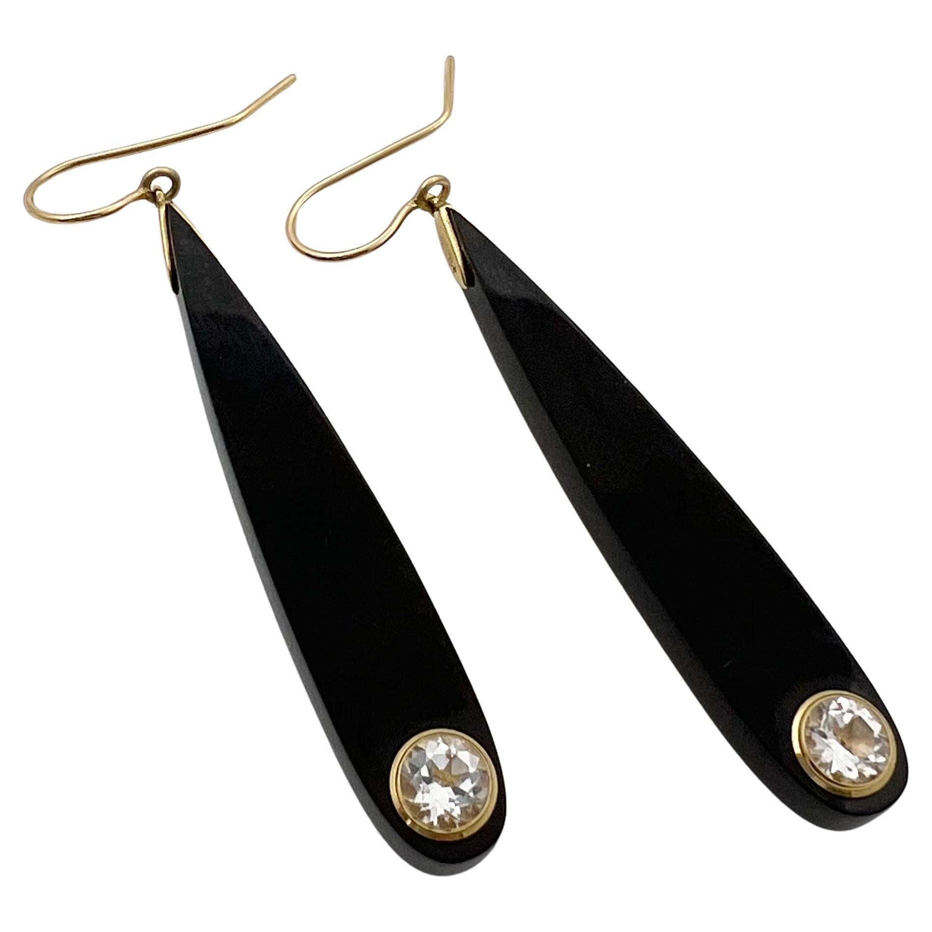 Mark Davis elongated, teardrop-shaped earrings, featuring vintage black bakelite with bezel-set round white topaz at the bottom.  Two white topaz weighing approximately 1.99 total carats. 18k yellow gold wire for pierced ears.  Marked '750' for 18