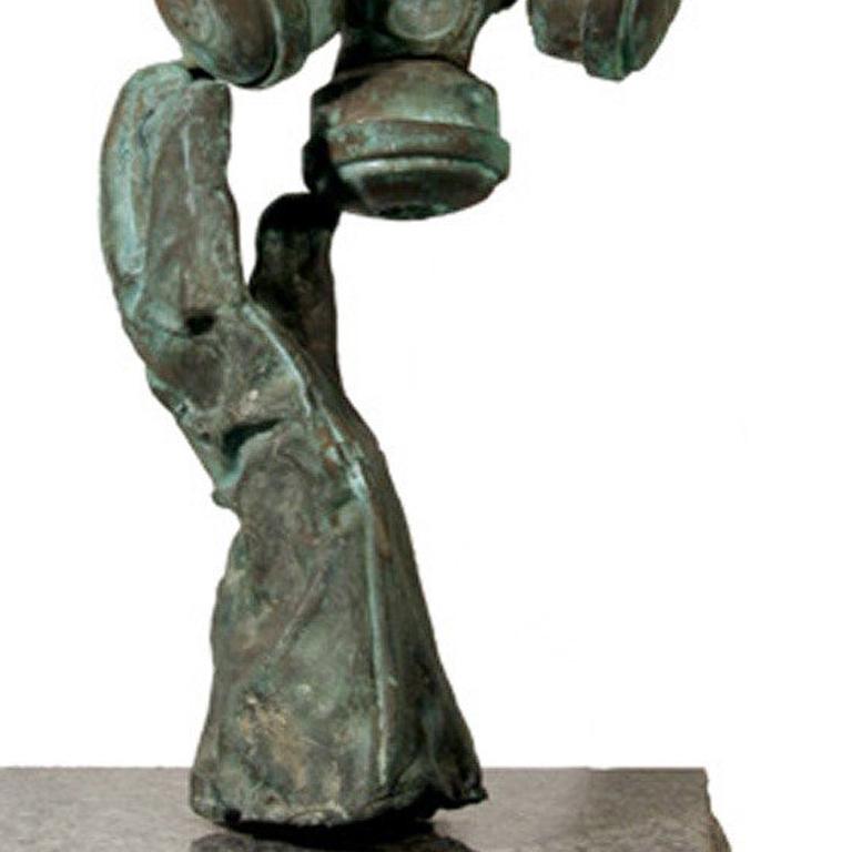 A bronze sculpture by Mark Eastridge. A surrealist composition of a bronze case gas mask sitting atop a glove.

Artist: Mark Eastridge, American
Title: Nonsense (Gas Mask)
Medium: Bronze Sculpture with Green Patina, mounded on granite base
Base