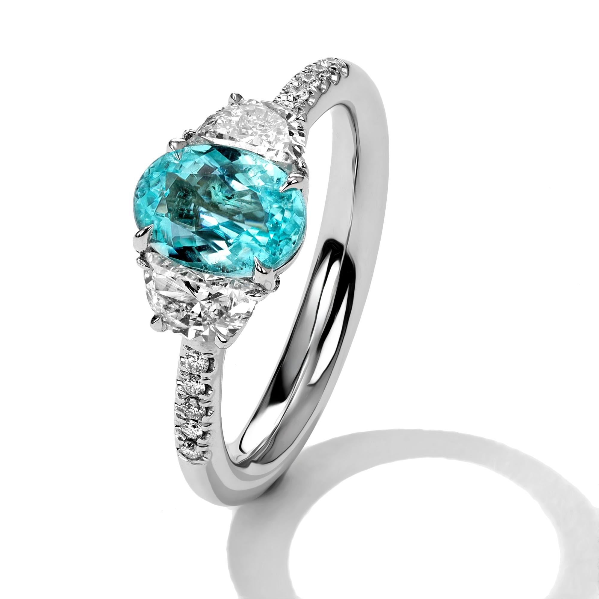 Metal: 18kt Gold
Paraiba Center Stone Weight: 1.22 ct.
Half Moon Diamond Weight: 0.71 ct.
Round Diamond Weight: 0.07 ct.
*Paraiba is Mozambique Origin

Mark Henry only selects breathtaking Paraiba that exhibit electrifying hues that range from green