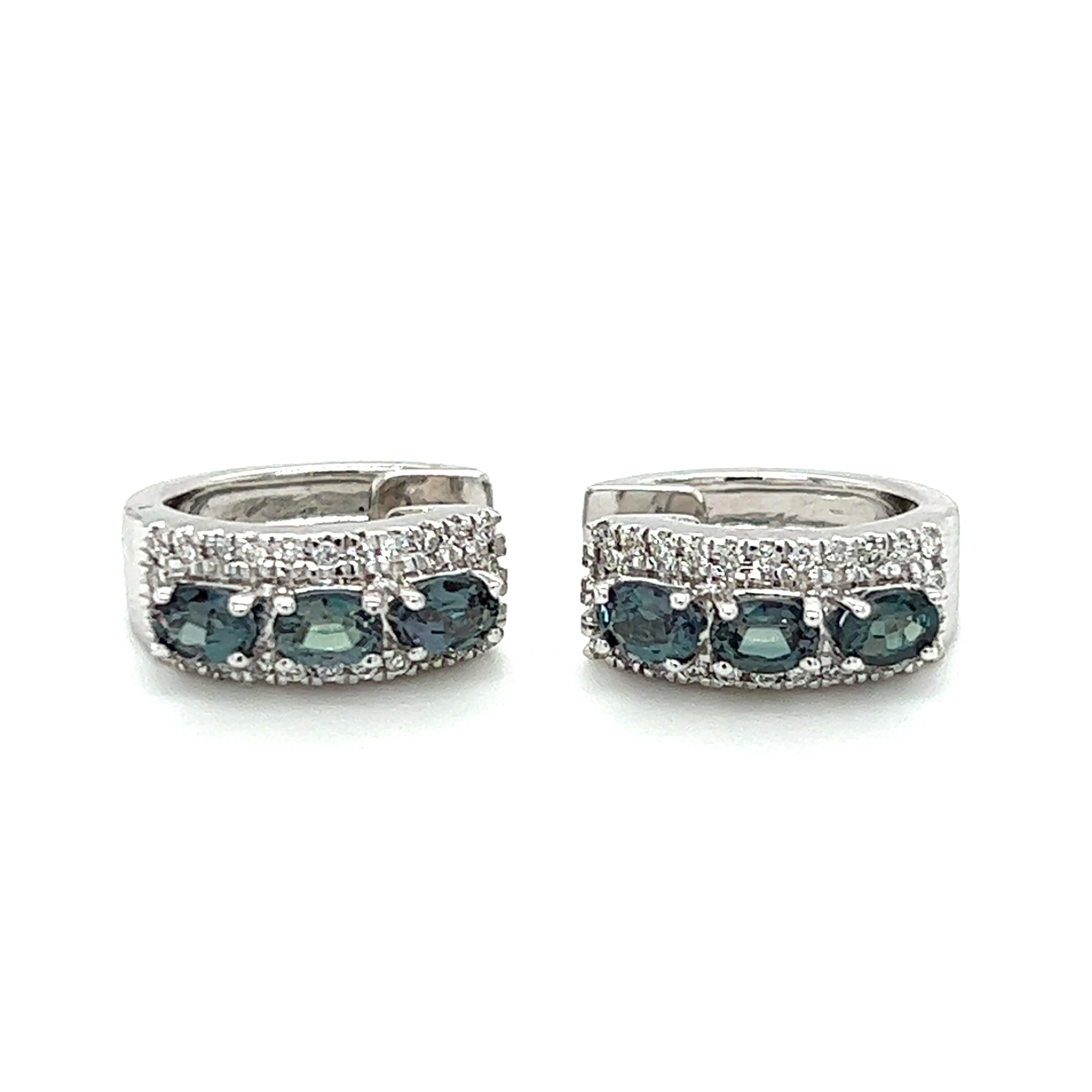 One pair of 18-karat white gold huggie hoop earrings, designed by Mark Henry, featuring six (6) oval natural Alexandrite stones, approximately 0.95-carat total weight, and Pavé set brilliant cut diamonds, approximately 0.20-carat total weight with