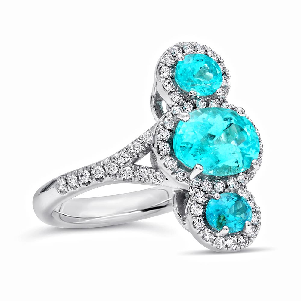 Paraiba Carat Weight: 3.08 carats
Oval Shape Paraiba Center: 2.16 carats
Diamond Weight: 0.46 Carats
The ring is set in 18k White Gold

Mark Henry only selects breathtaking Paraiba that exhibit electrifying hues that range from green to