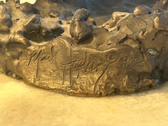 Mark Hopkins, bronze titled “Fishing Grizzly”.grizzly bear with rainbow trout