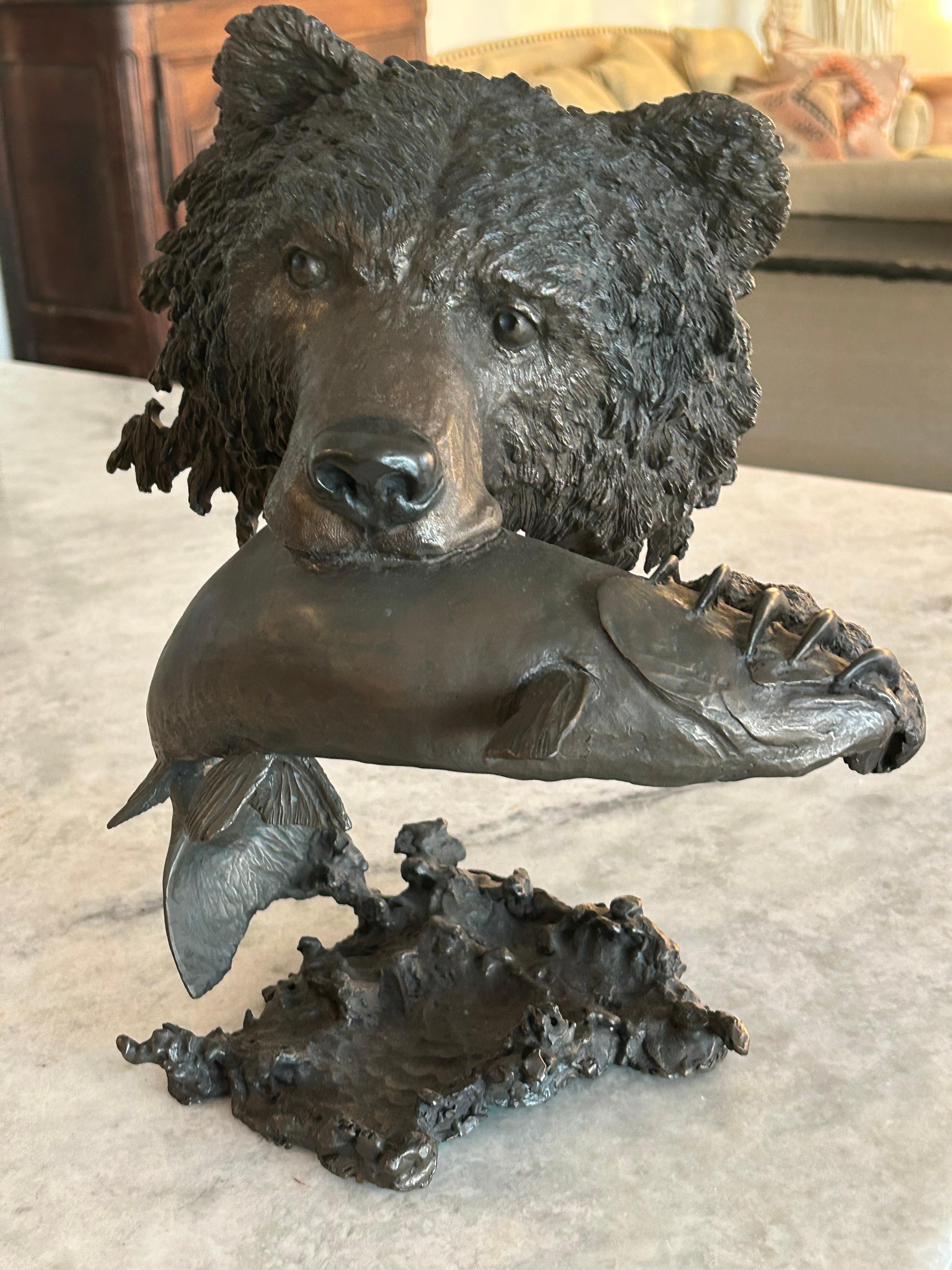 Bronze Mark Hopkins, bronze titled “Fishing Grizzly”.grizzly bear with rainbow trout