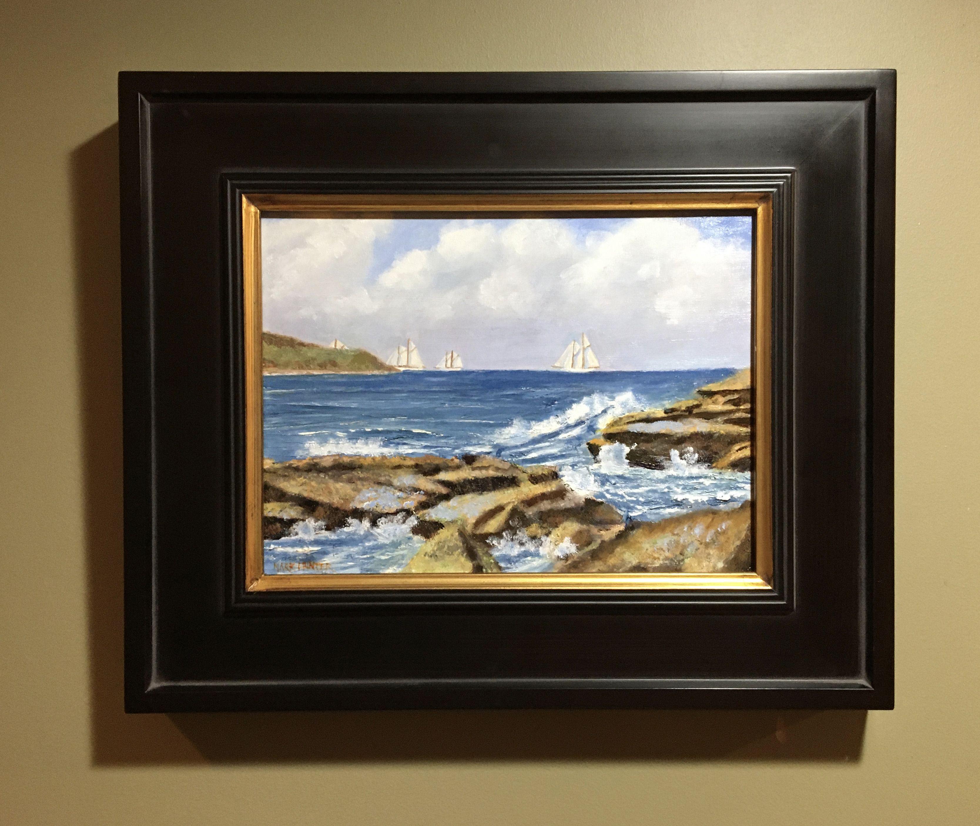 Waves crash on the rocky shore as schooners sail by in the distance.    Framed and ready to hang. 3