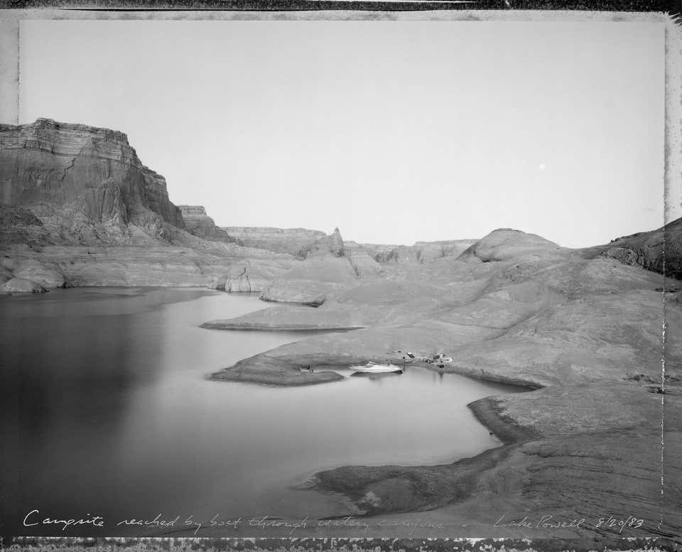 Campsite reached by boat through watery canyons, Lake Powell, 8/20/83