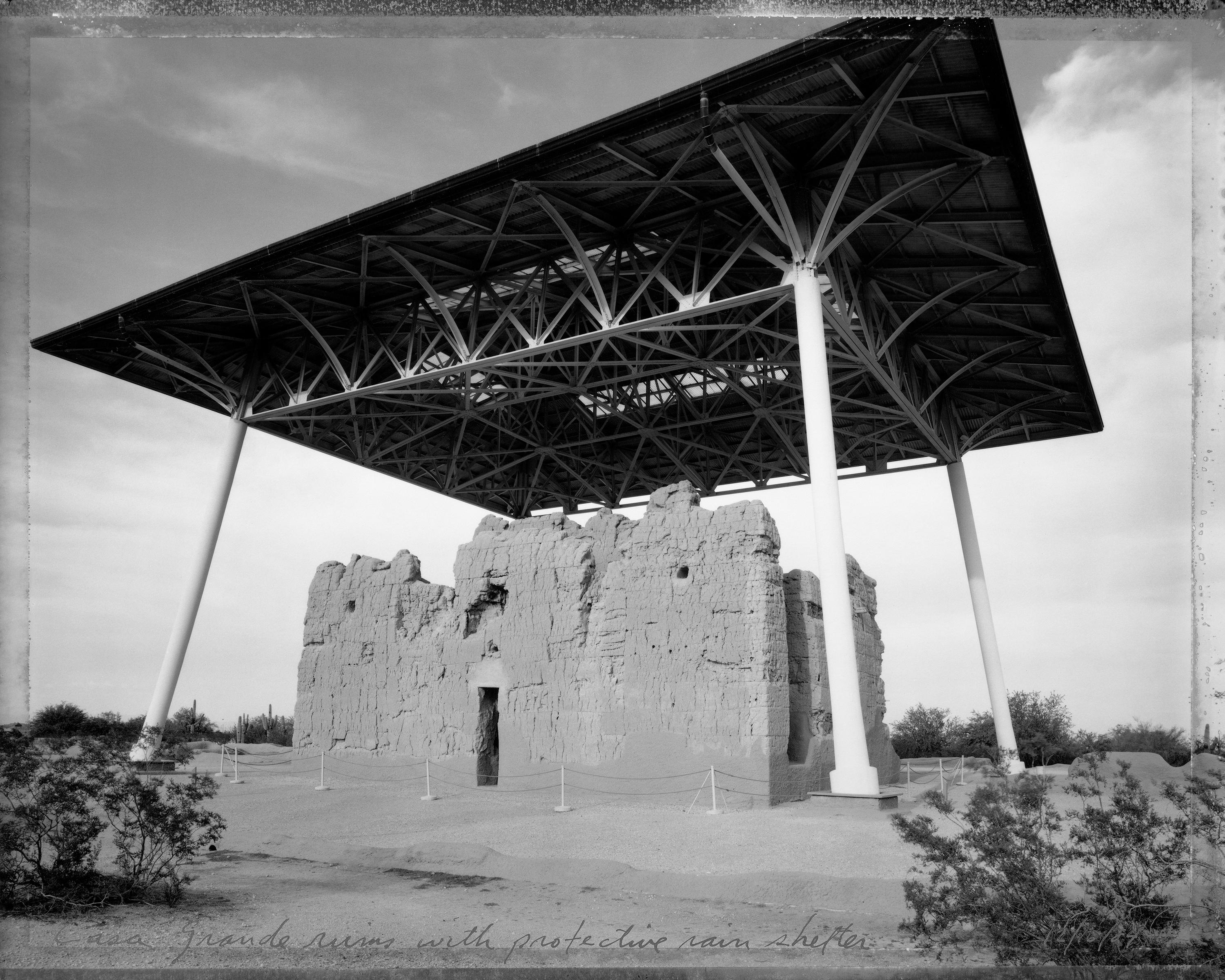Mark Klett Black and White Photograph - Casa Grande ruins with protective rain shelter, 12/16/84 