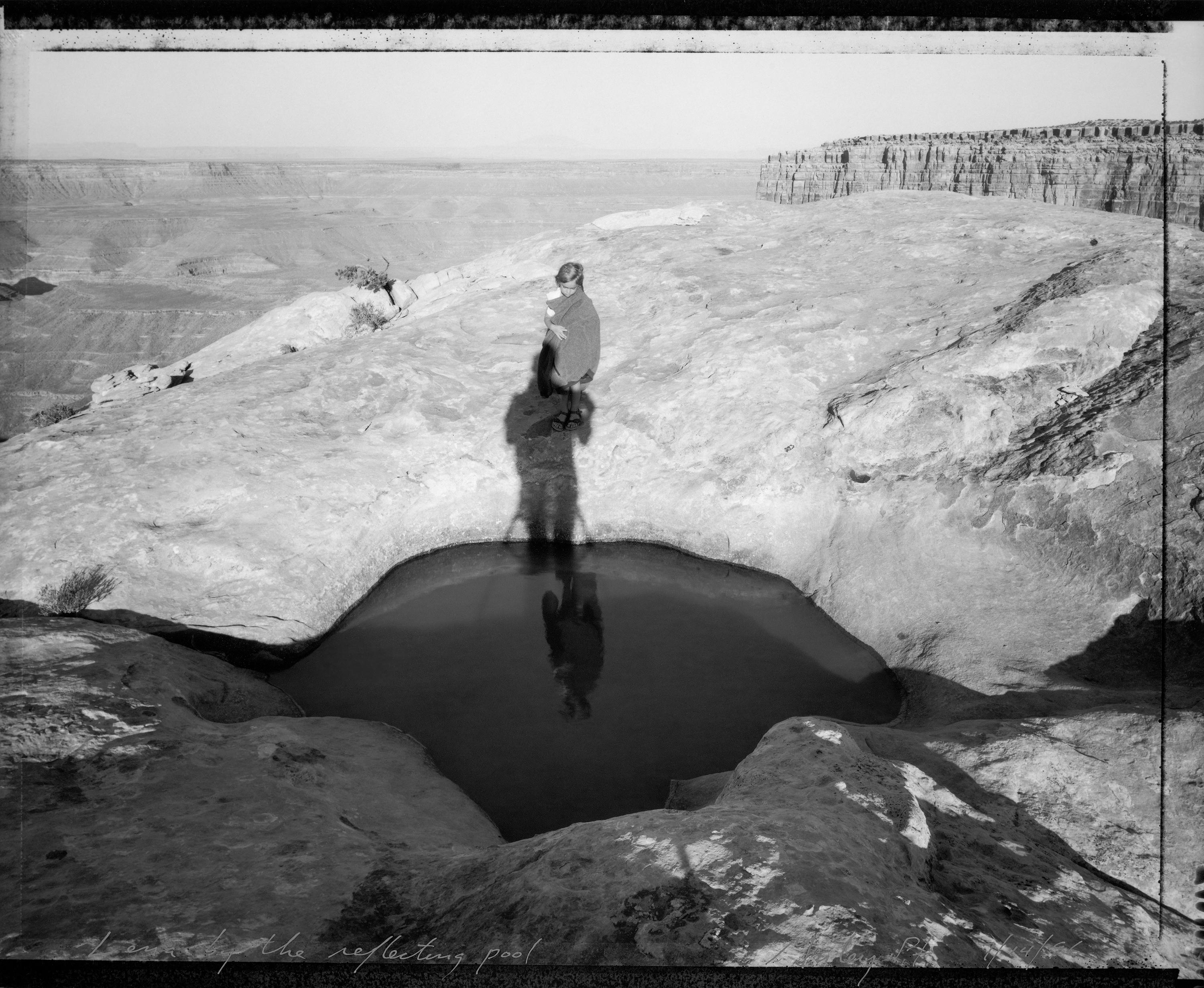 Mark Klett Black and White Photograph - Lena by reflecting pool, Muley Pt., 7/14/96 