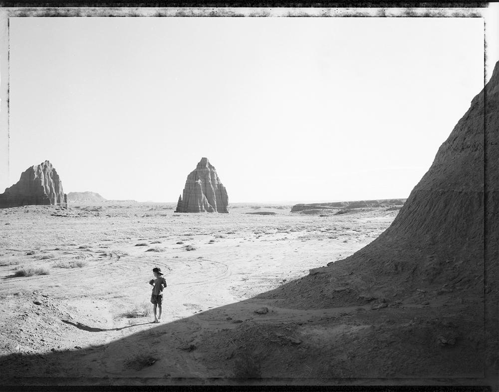 Mark Klett Black and White Photograph - Luke listening to his stereo, Cathedral Valley, Utah, 4/23/94