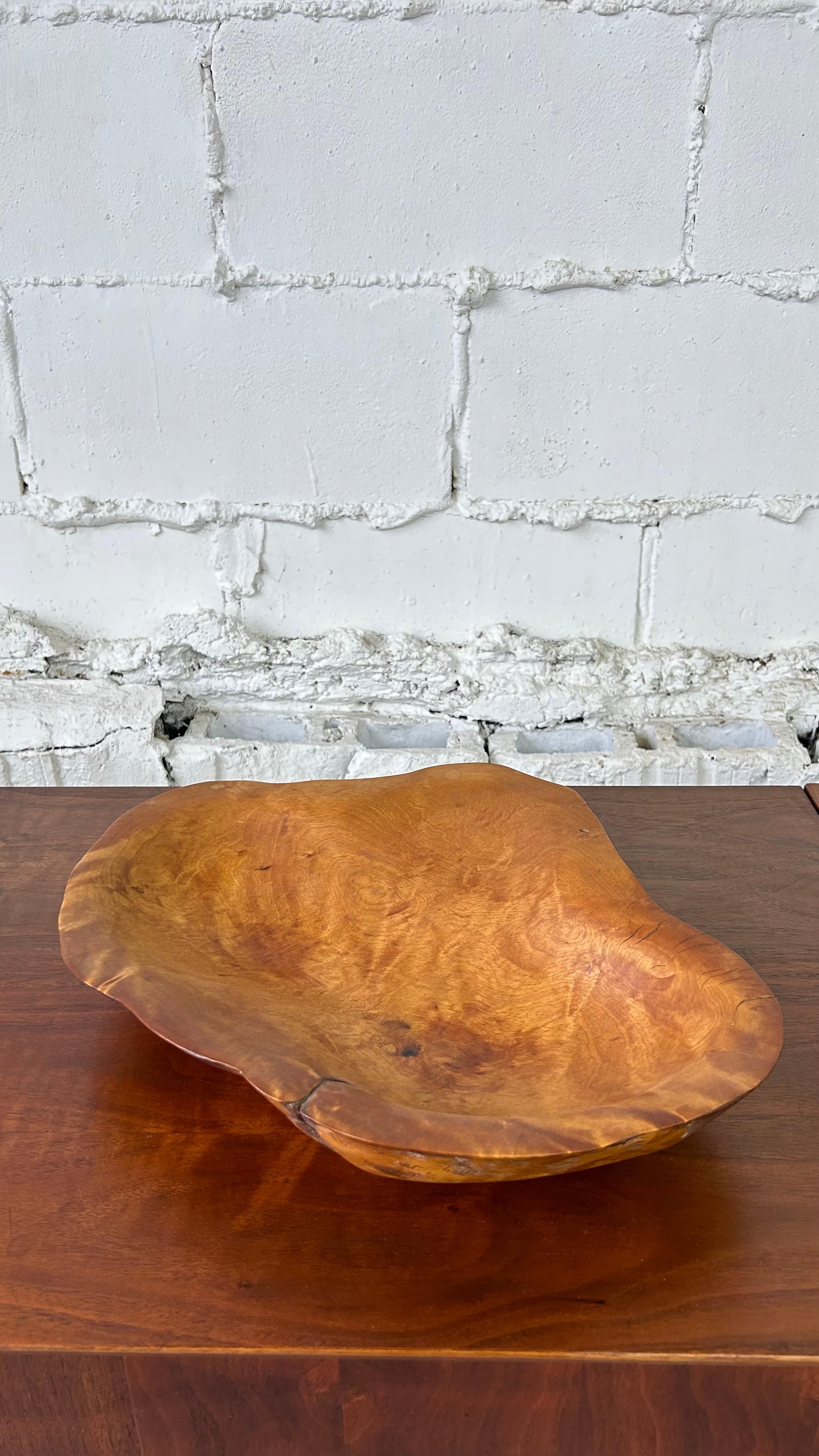 About the piece:
One-of-a-kind yellow birch burl wood bowl by famous American sculptor, Mark Lindquist.  This rare piece is signed by the artist on the underside and dated 1979.  It is a large example of his work measuring over 15