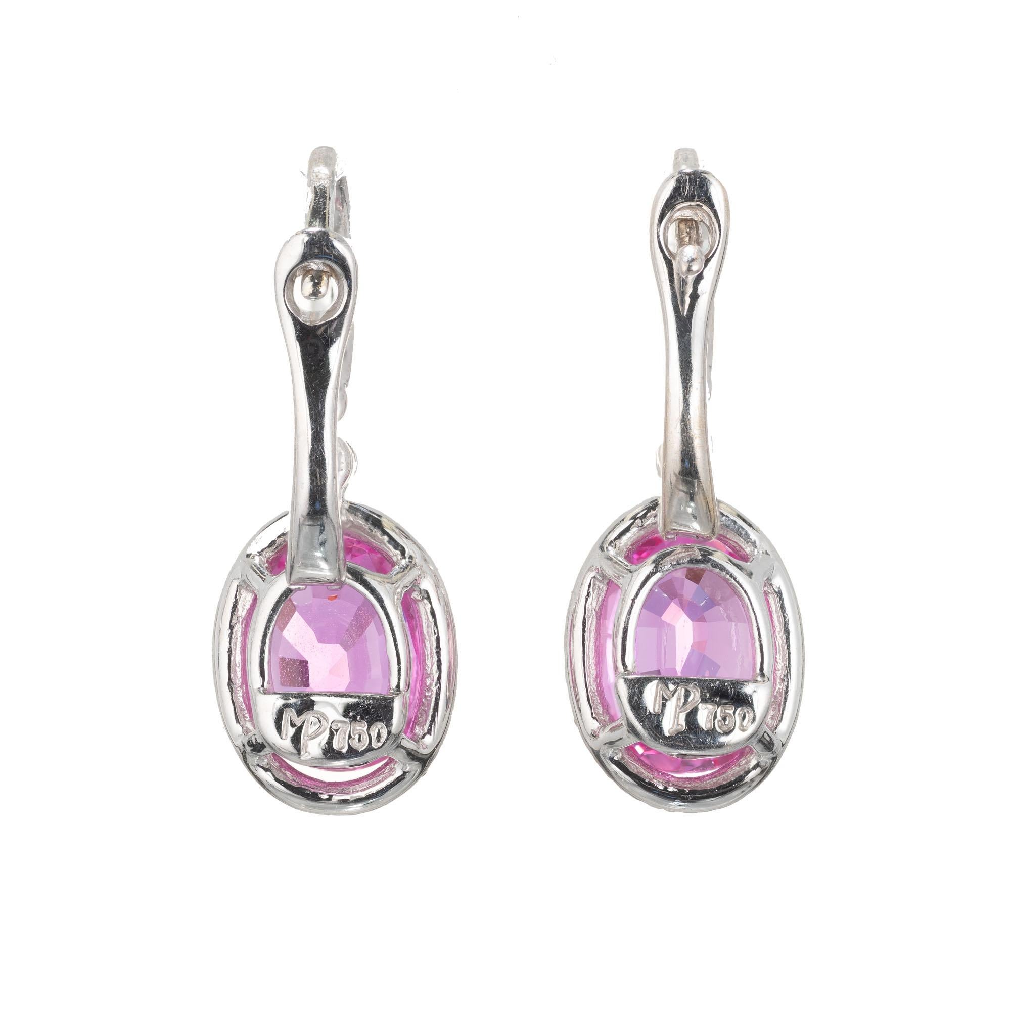 Mark Patterson hot pink oval Sapphire and simple halo design wire top dangle earrings. 18k white gold. 

2 oval hot pink gem pink Sapphires 8 x 6mm oval, approx. total weight 3.50cts, natural color, simple heat only TE, no other enhancements. GIA