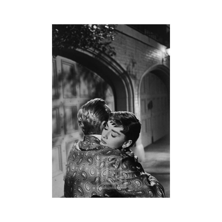 Mark Shaw Figurative Photograph - Audrey Hepburn and William Holden on Set of Sabrina, Embrace, 1953