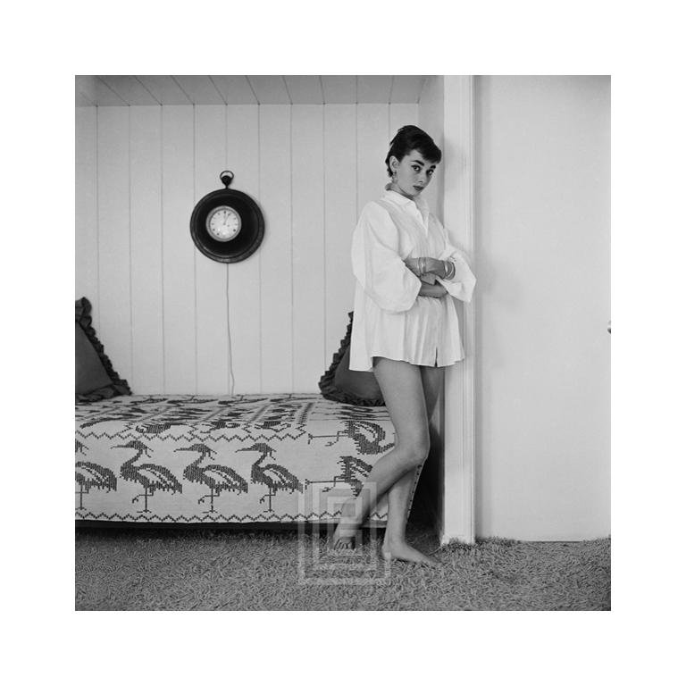 Mark Shaw Black and White Photograph - Audrey Hepburn at Home, Heron Day Bed, Arms Crossed, 1954