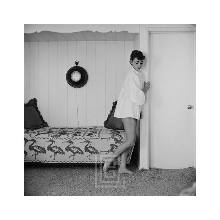 Mark Shaw Portrait Photograph - Audrey Hepburn at Home, Heron Day Bed, Looks Down, 1954
