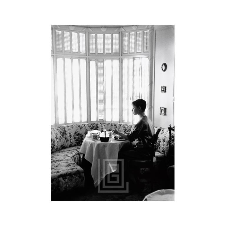 Mark Shaw Black and White Photograph - Audrey Hepburn Breakfast, 1953