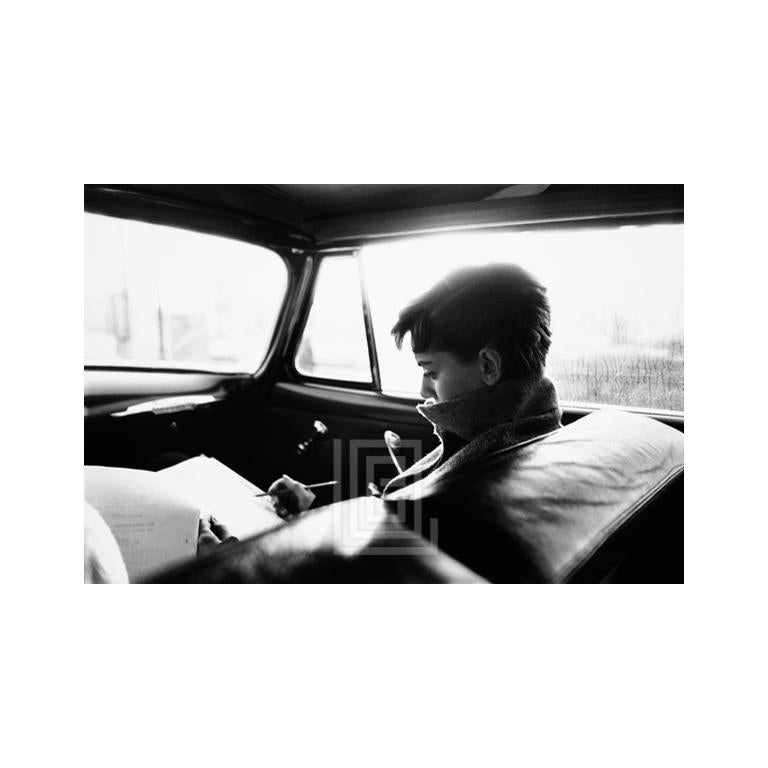 Mark Shaw Black and White Photograph - Audrey Hepburn in Car Writing, 1953