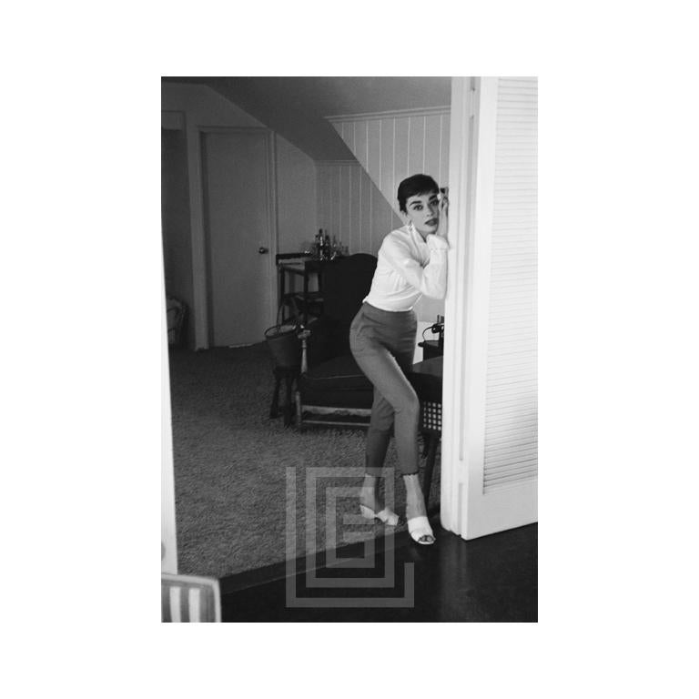 Mark Shaw Black and White Photograph - Audrey Hepburn in Doorway, 1953