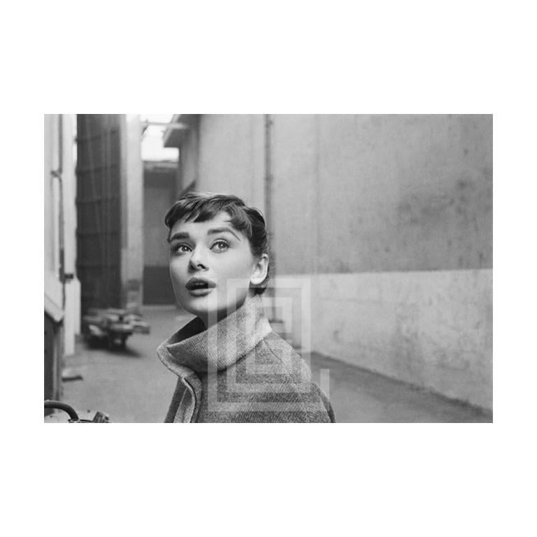Mark Shaw Portrait Photograph - Audrey Hepburn in Grey Turtleneck Sweater, Looking Up, 1953