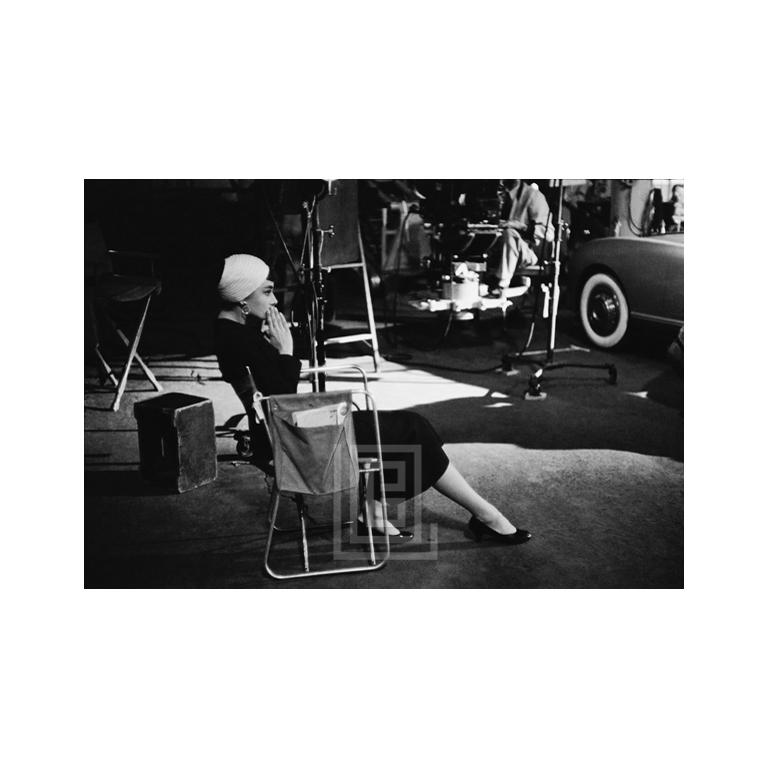 Mark Shaw Figurative Photograph - Audrey Hepburn on Set of Sabrina, Sitting, 1953