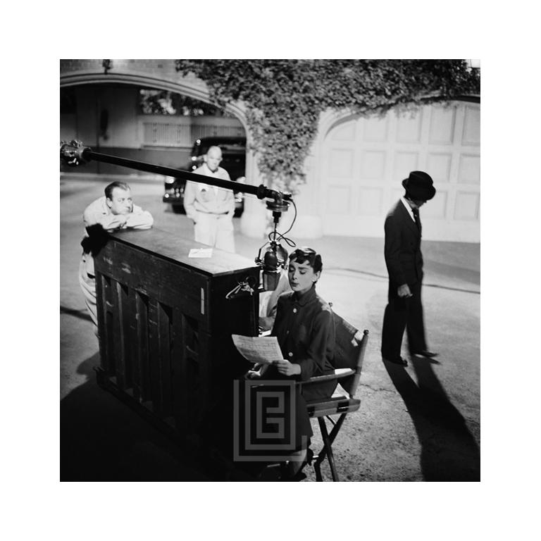 Mark Shaw Black and White Photograph - Audrey Hepburn Records Song, Head Straight, 1953