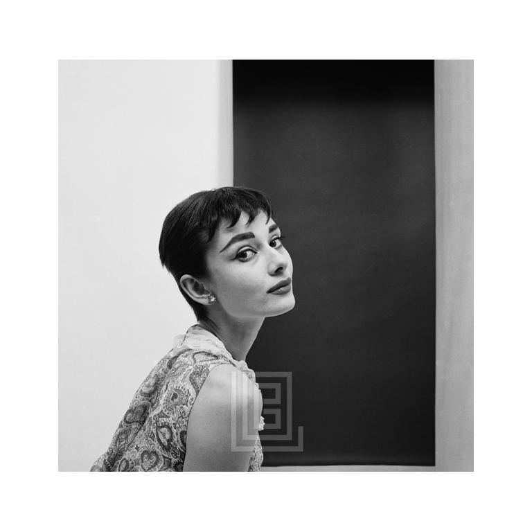 Black and White Photograph Mark Shaw - Audrey Hepburn Staring with Head Back (Audrey Hepburn avec tête en arrière), 1954
