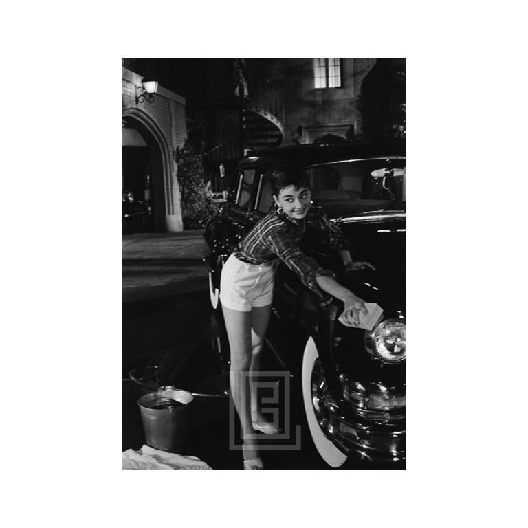 Mark Shaw Portrait Photograph – Audrey Hepburn Washes Auto, 1953