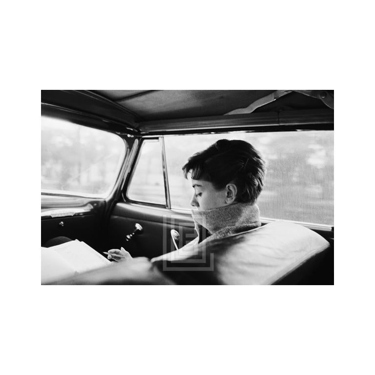 Mark Shaw Black and White Photograph - Audrey in Car, Writing, 1953