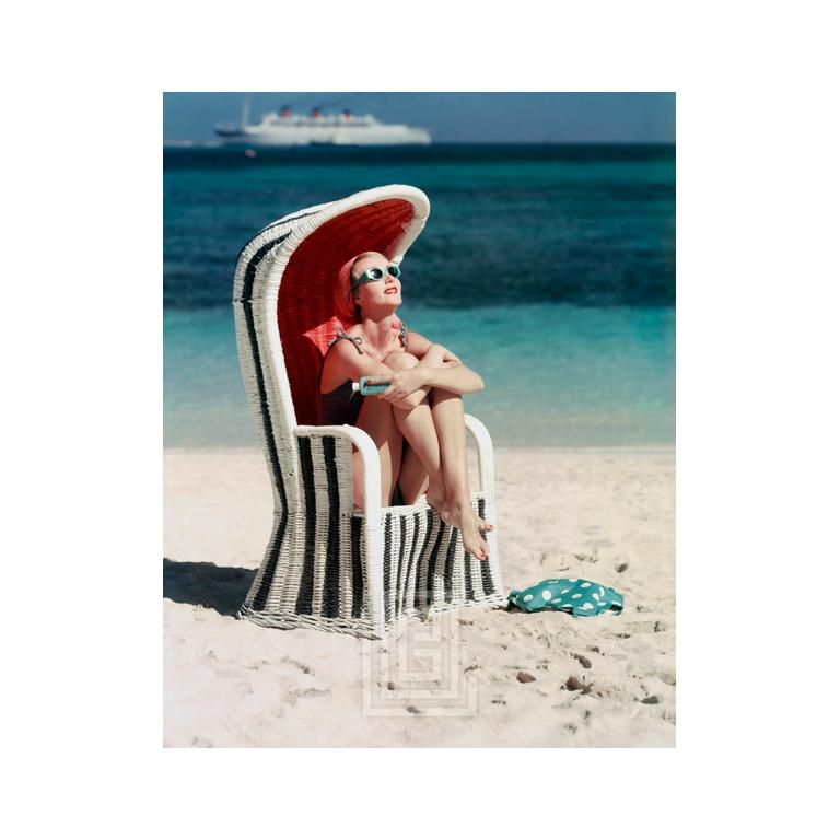 Mark Shaw Figurative Photograph - Beach Striped Chair, Circa 1955