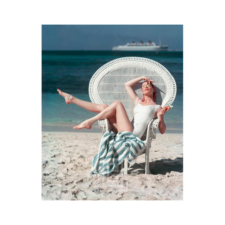 Mark Shaw Color Photograph - Beach White Chair, Circa 1955