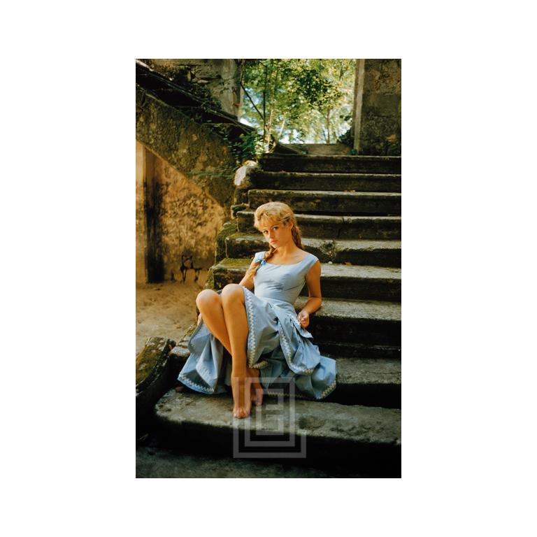 Mark Shaw Color Photograph - Brigitte Bardot in Braids Crossed Ankles, 1958