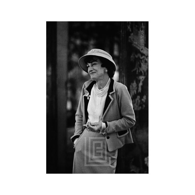 Mark Shaw Black and White Photograph – Coco Chanel Shrugs, 1957