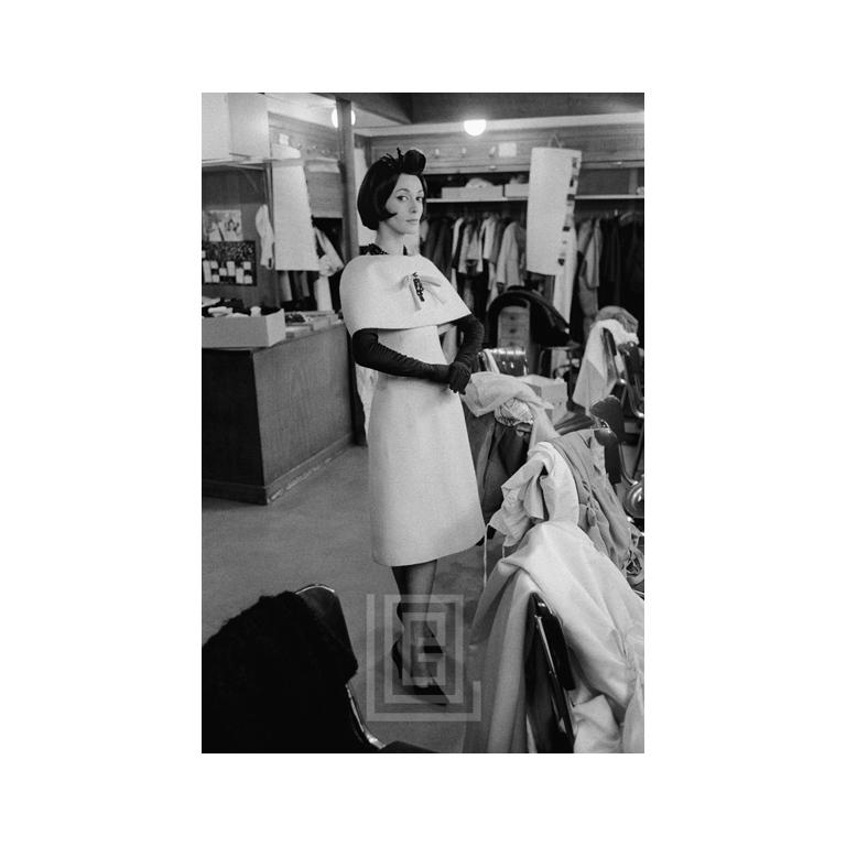 Mark Shaw Portrait Photograph - Dior, Model Kouka wears Novia while Standing, 1959