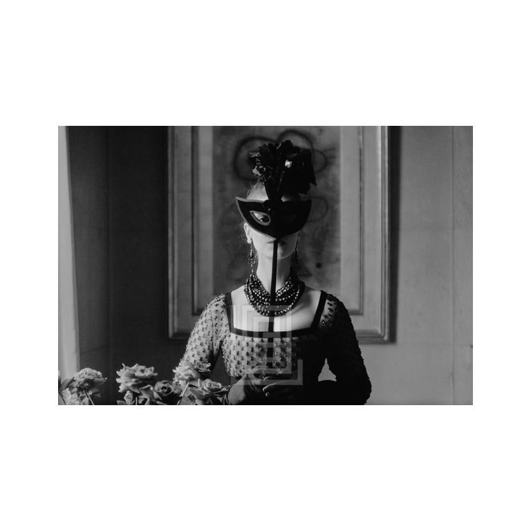 Mark Shaw Figurative Photograph - Dior, St. Laurent's Mask with Lola Dress, 1958.