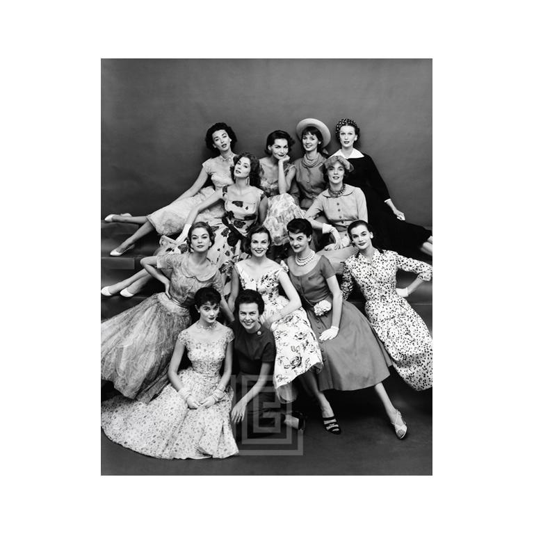 Mark Shaw Figurative Photograph - Eileen Ford Poses with Models, 1954