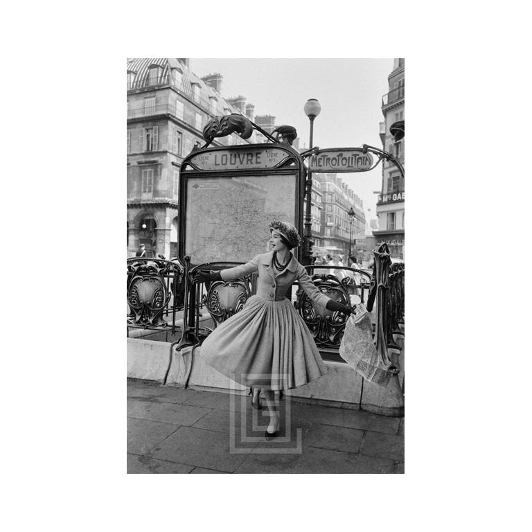 Mark Shaw Figurative Photograph - Grey Dior Outside Paris Louvre Metro, Side, BW, 1957