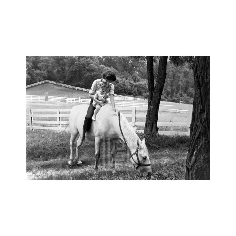 Mark Shaw Figurative Photograph - Kennedy, Jackie and Caroline on Horse, 1959