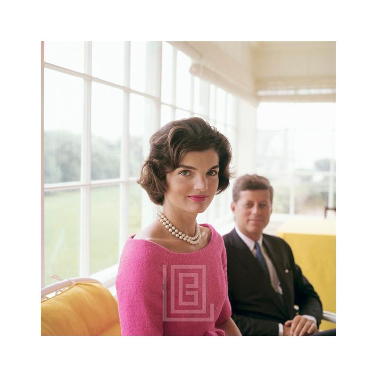 Mark Shaw Color Photograph - Kennedy, Jackie in Pink with JFK in Yellow Room, Demure, 1959