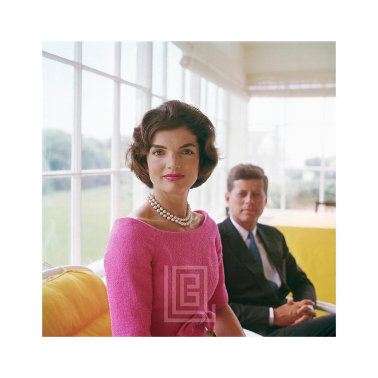Mark Shaw Color Photograph - Kennedy, Jackie in Pink with JFK in Yellow Room, John Look on, 1959
