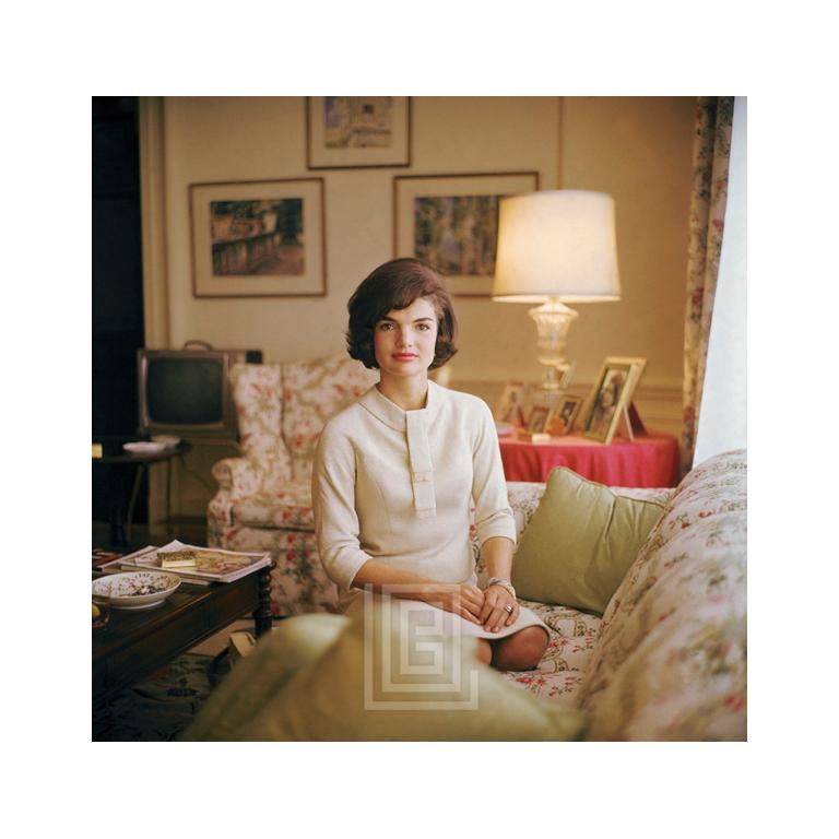 Mark Shaw Color Photograph - Kennedy, Jackie on Sofa, Hands on Lap, 1961