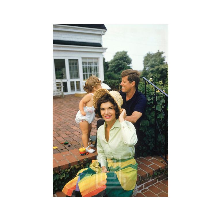 Mark Shaw Figurative Photograph - Kennedys, Jackie in Straw Hat & Colorful Skirt, w/John & Caroline, Hyannis Patio