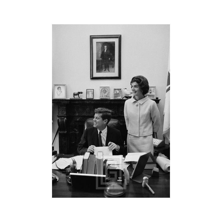 Mark Shaw Black and White Photograph - Kennedys, JFK and Jackie at Senate Desk, Smiling