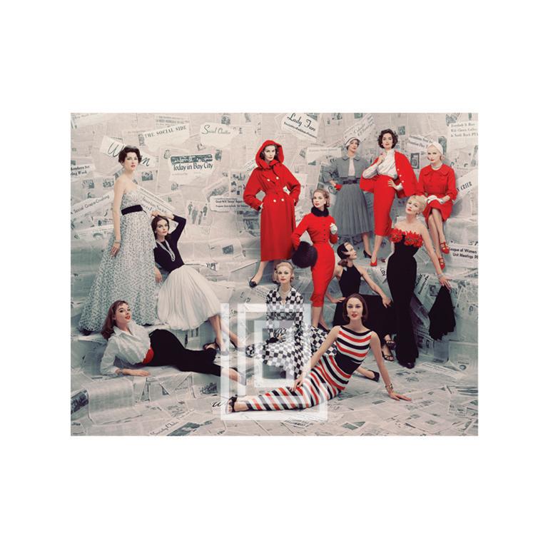 Mark Shaw Color Photograph - Models in front of Newspaper Wall